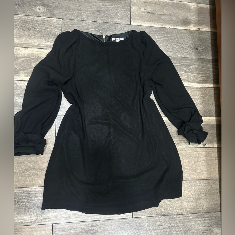 NICOLA Black Long Sleeve Dress with cut bows on the sleeve.